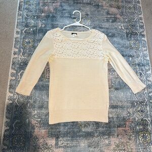 J.Crew cream/ivory crewneck sweater with lace cutout detail.